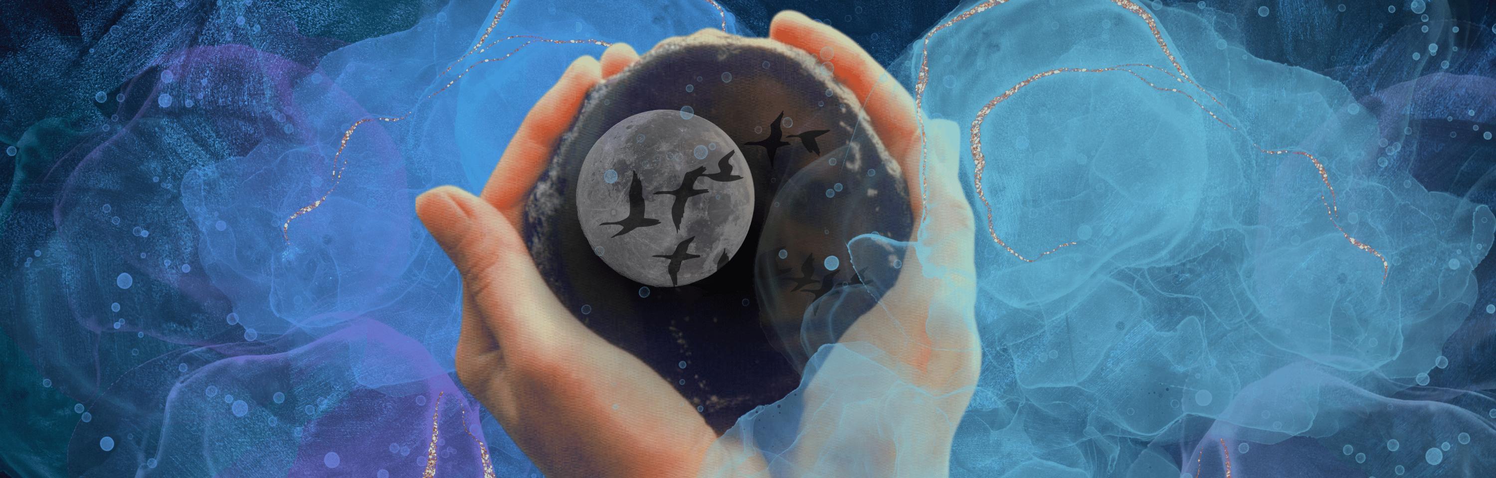 Hands holding a dark stone with a full moon and black bird silhouettes inside